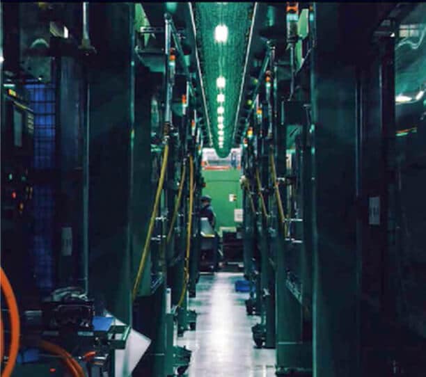 A Modern Automated Factory Assembly Line With Advanced Machinery And Green Lighting